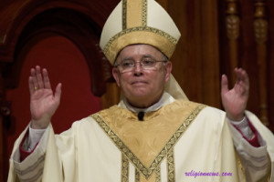 (RNS2-SEPT08) Archbishop Charles J. Chaput acknowledges applause during his Mass of installation at the Cathedral Basilica of Sts. Peter and Paul in Philadelphia Sept. 8. For use with RNS-PHILLY-CHAPUT, transmitted Sept. 8, 2011. Pool photo courtesy Nancy Wiechec/Catholic News Service.